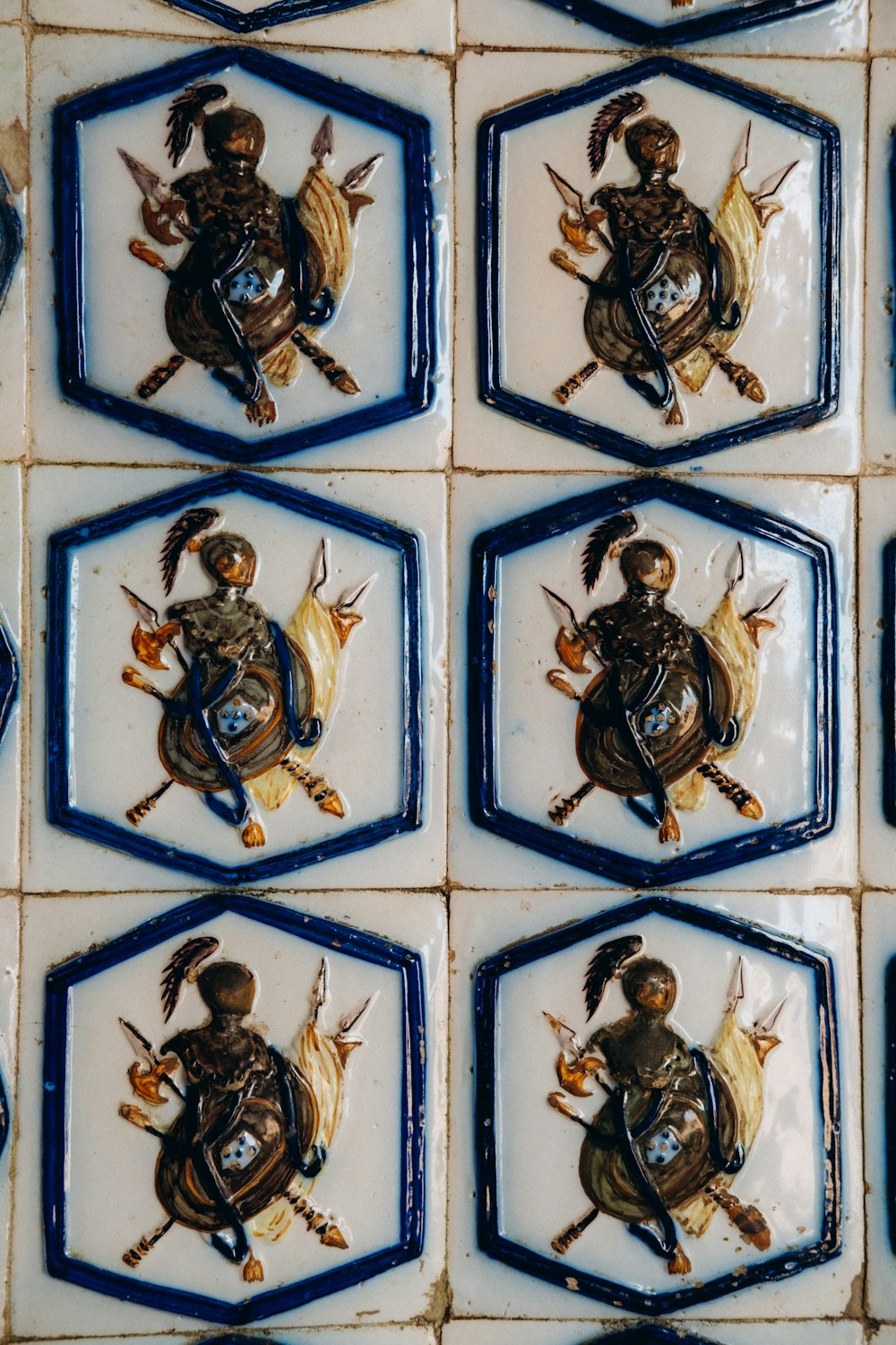 a tile wall with a picture of a person on it