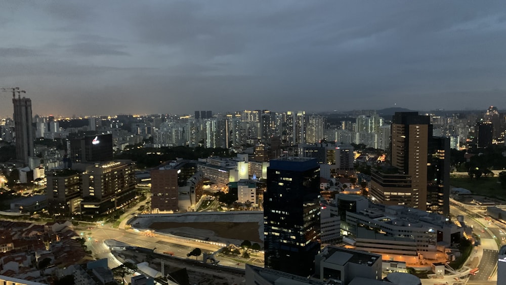 a view of a city at night from the top of a building