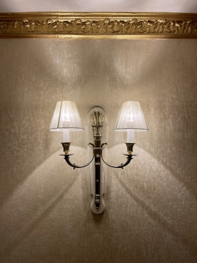 Side view of a vintage wall sconce with aged brass finish.