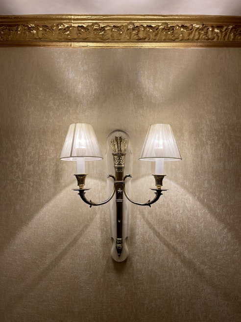 Elegant wall sconces illuminating a stylish living room corner