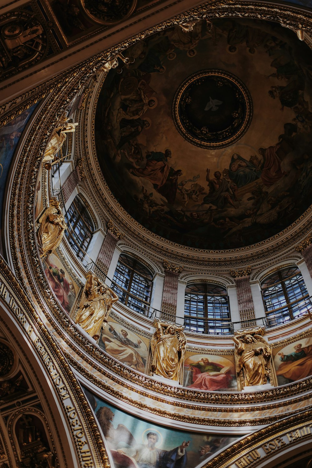 the ceiling of a building with paintings on it