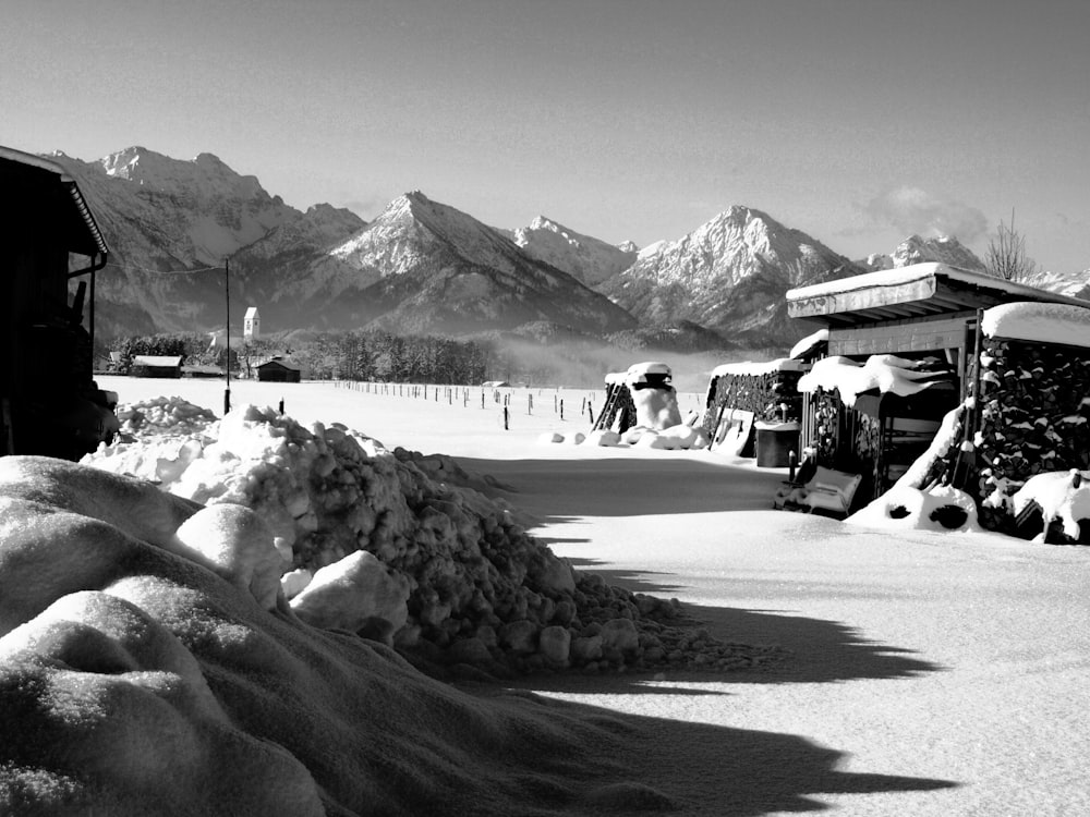 a black and white photo of snow covered mountains