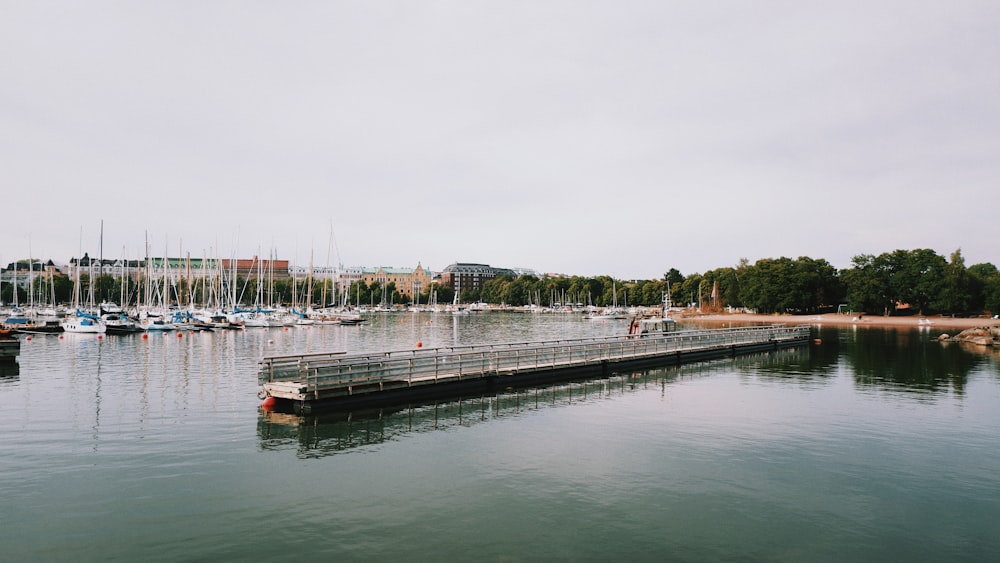 a harbor filled with lots of boats on a cloudy day