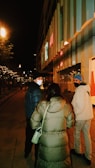 A cozy urban street scene featuring people wearing fashionable modern apparel.