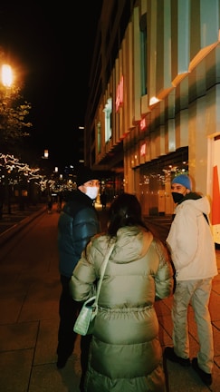 A cozy urban street scene featuring people wearing fashionable modern apparel.