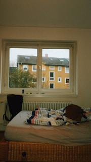 Cozy student room with unpacked suitcases and study materials ready for the semester.