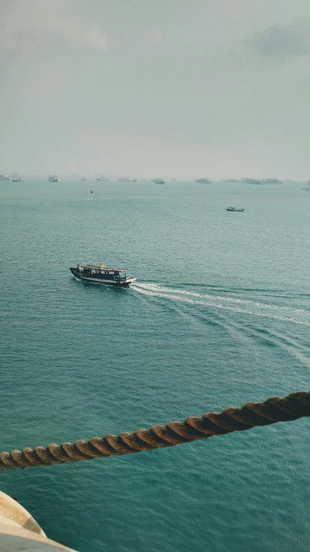 a boat traveling across a large body of water