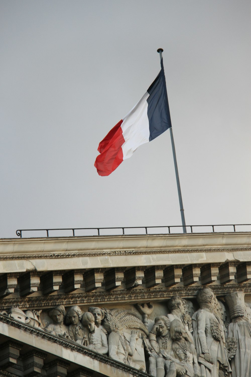 a flag flying on top of a building