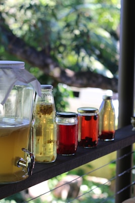 Bottles of flavoured kombucha with fruit ready for second fermentation
