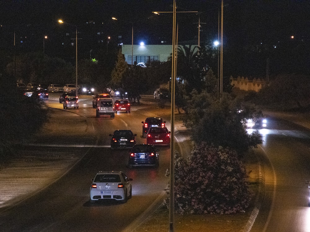 a highway filled with lots of traffic at night