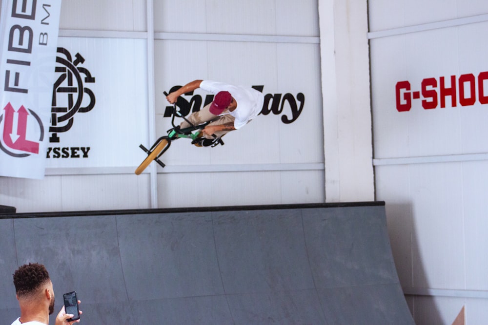 a man flying through the air while riding a skateboard