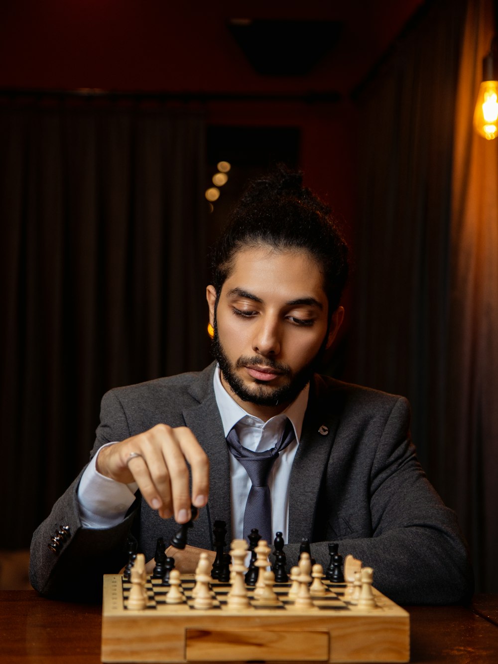 a man in a suit sitting at a table