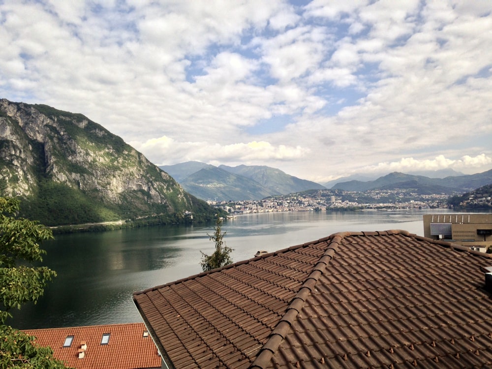 a view of a body of water with mountains in the background