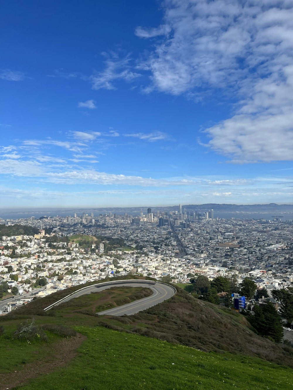 a view of a city from the top of a hill