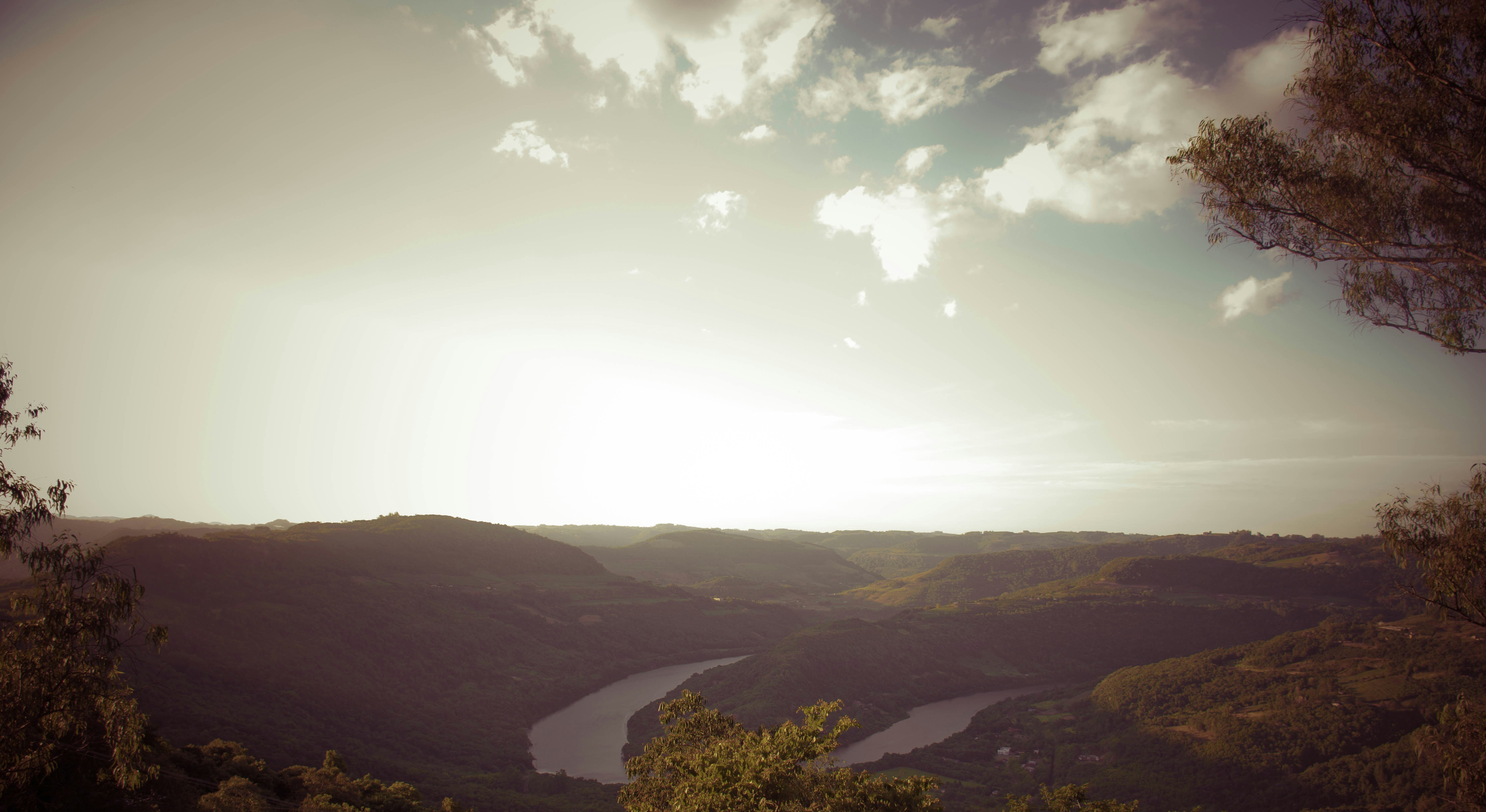 Sun Is Shining Over a Valley and a River