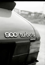 a black and white photo of the back of a car