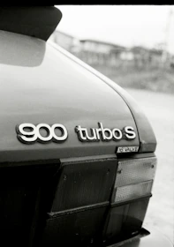 a black and white photo of the back of a car