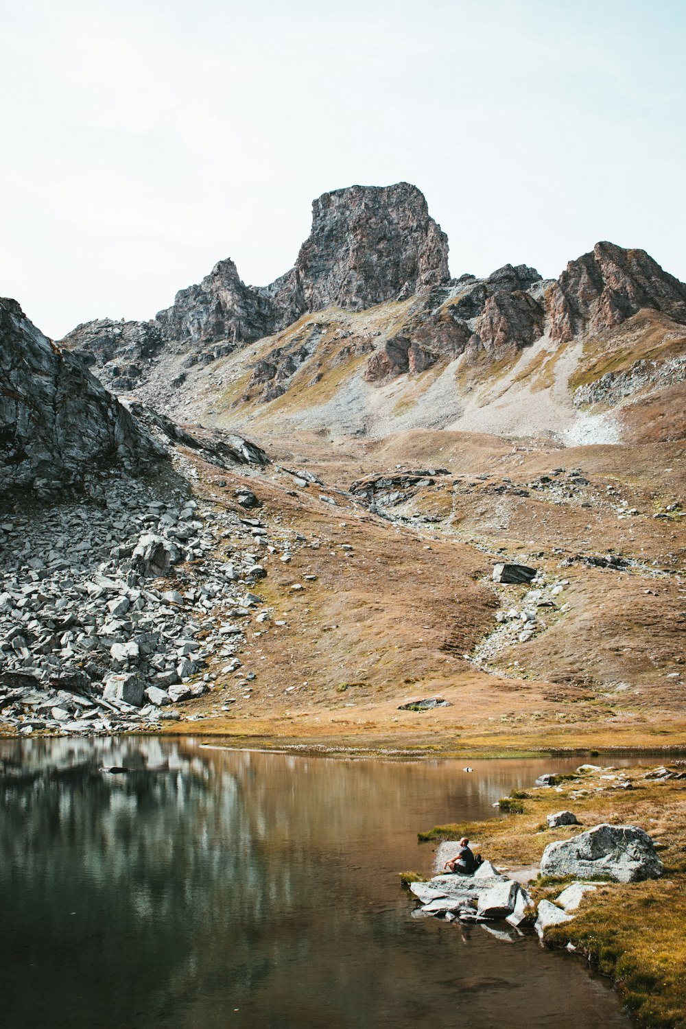 a body of water with a mountain in the background