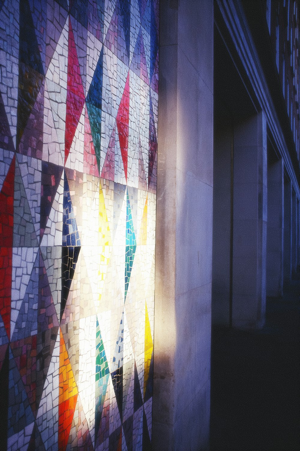 a wall with a colorful mosaic design on it