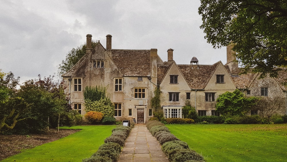 a large house with a stone walkway in front of it