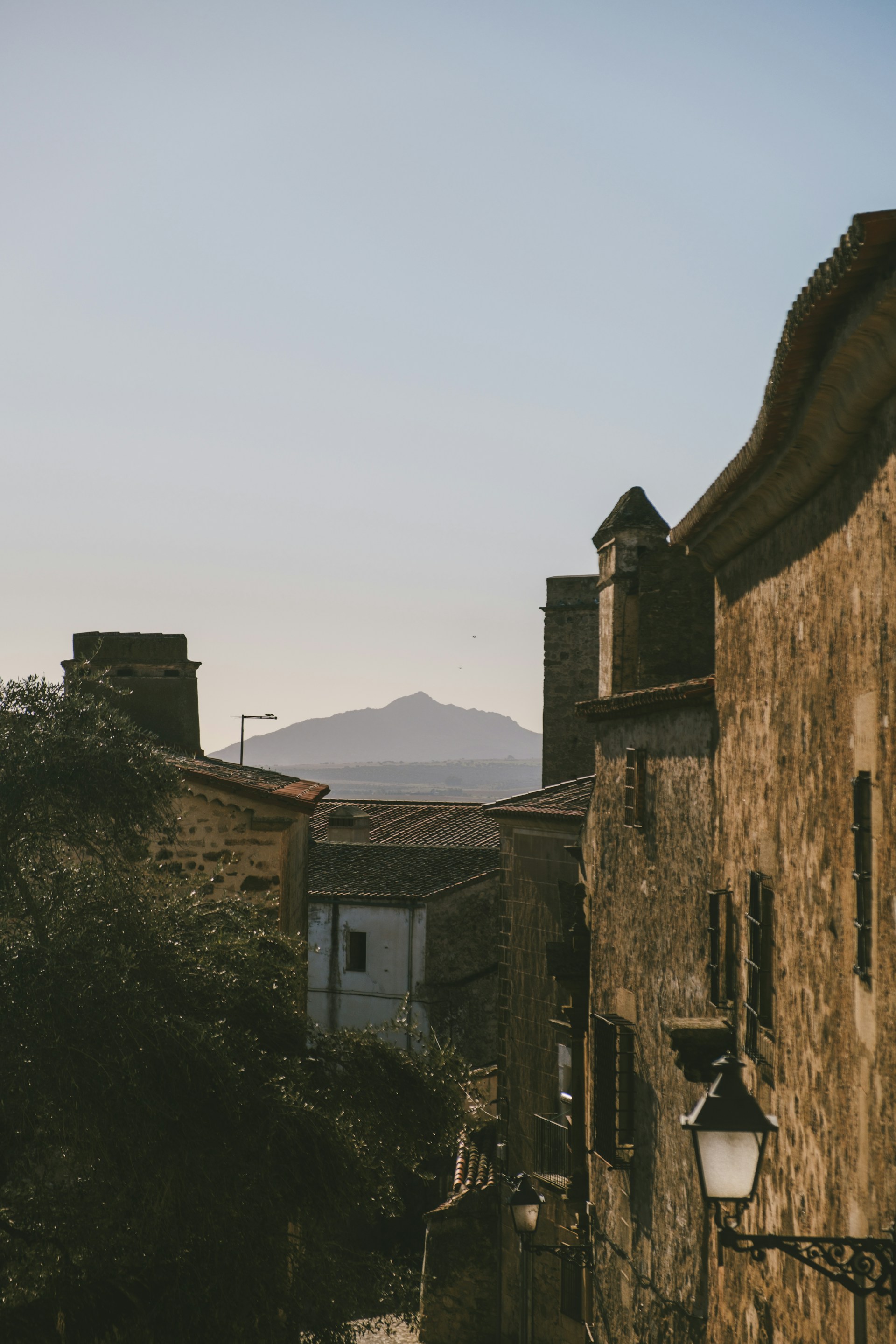 a view of a street with a mountain in the background