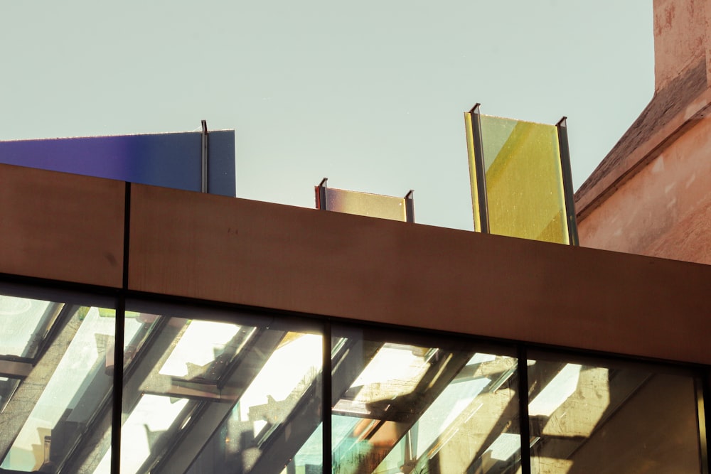 a close up of a building's windows with a sky background