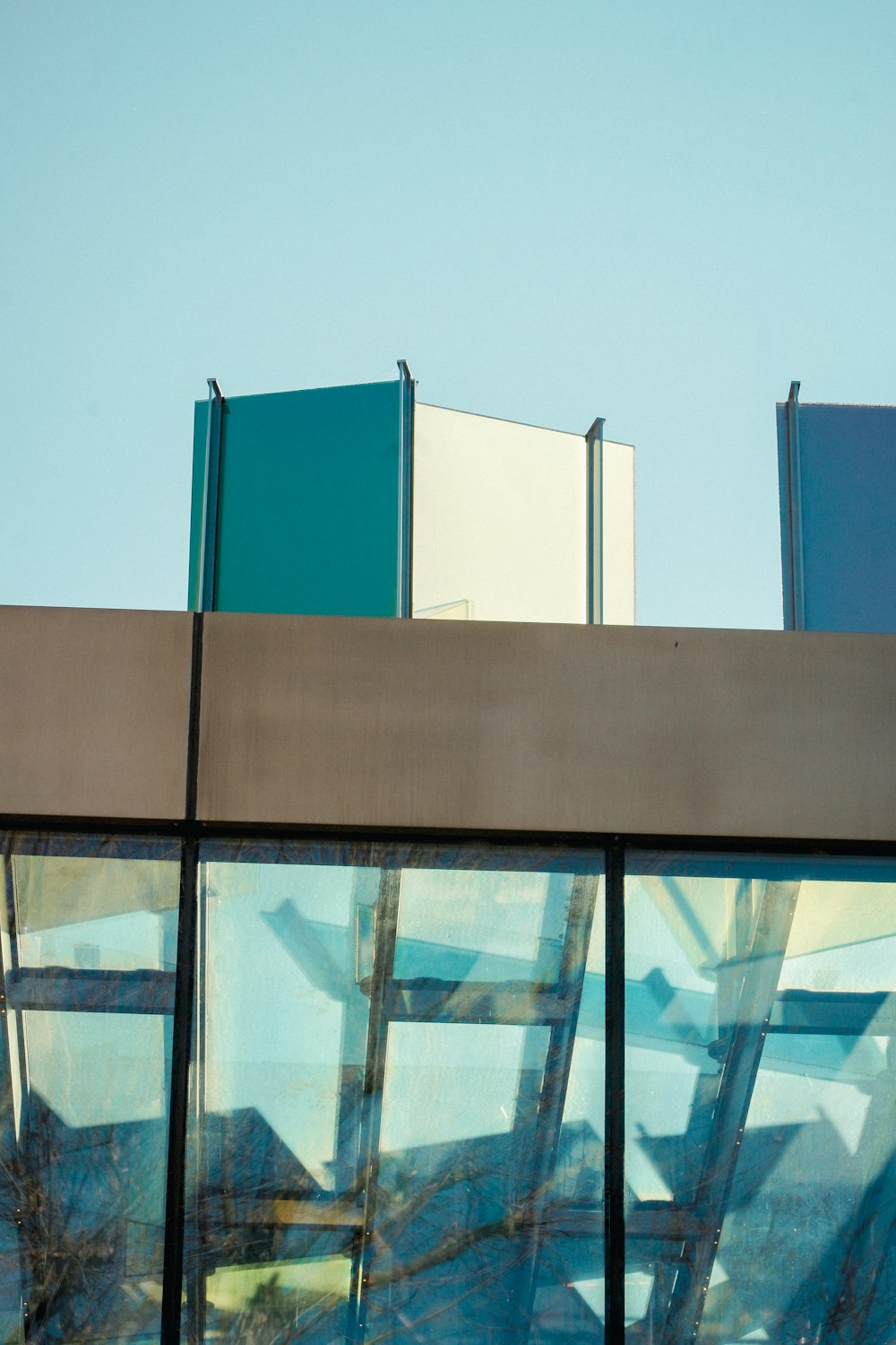 the reflection of a building in the windows of another building