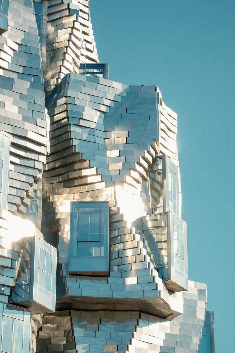 a sculpture of a person made out of windows