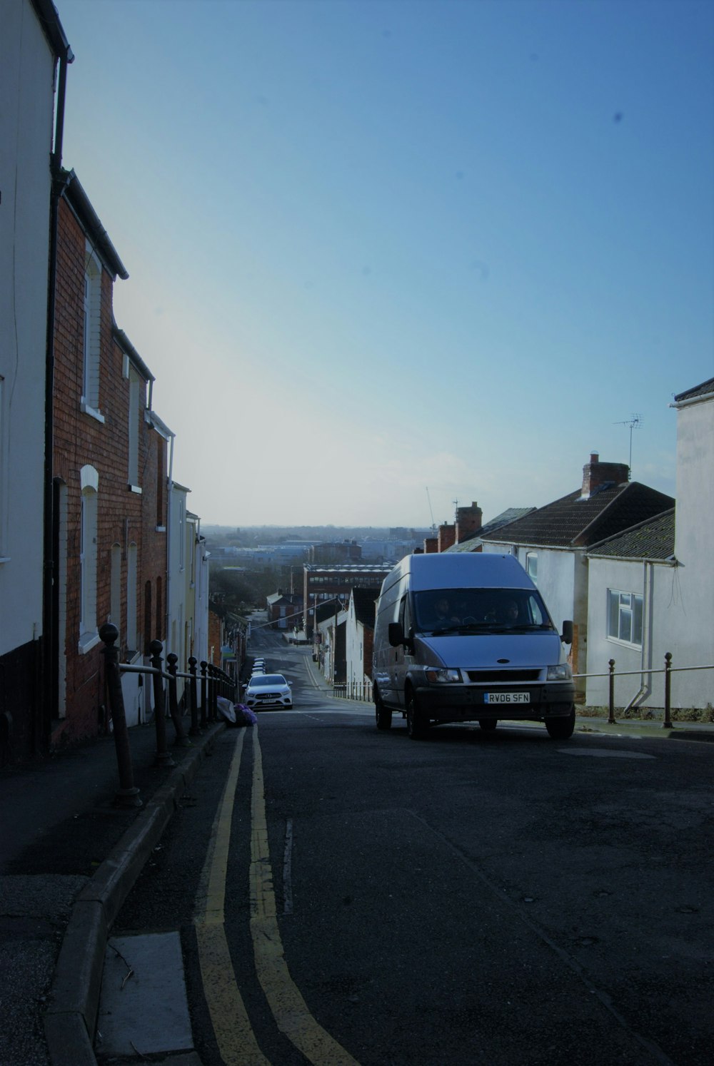 a van is parked on the side of the road