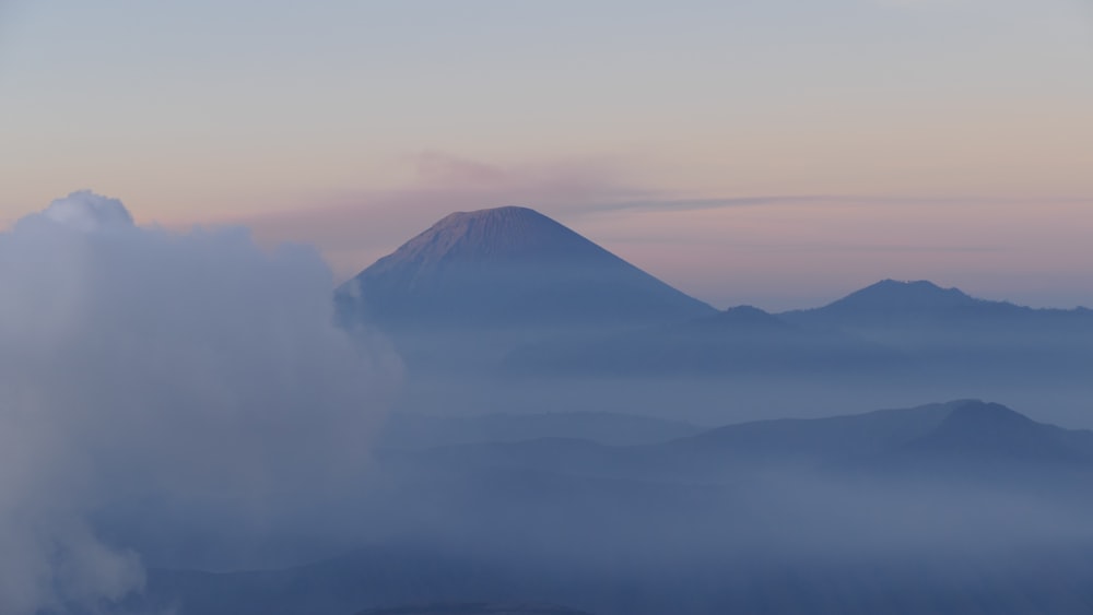 a view of a mountain in the distance from a plane