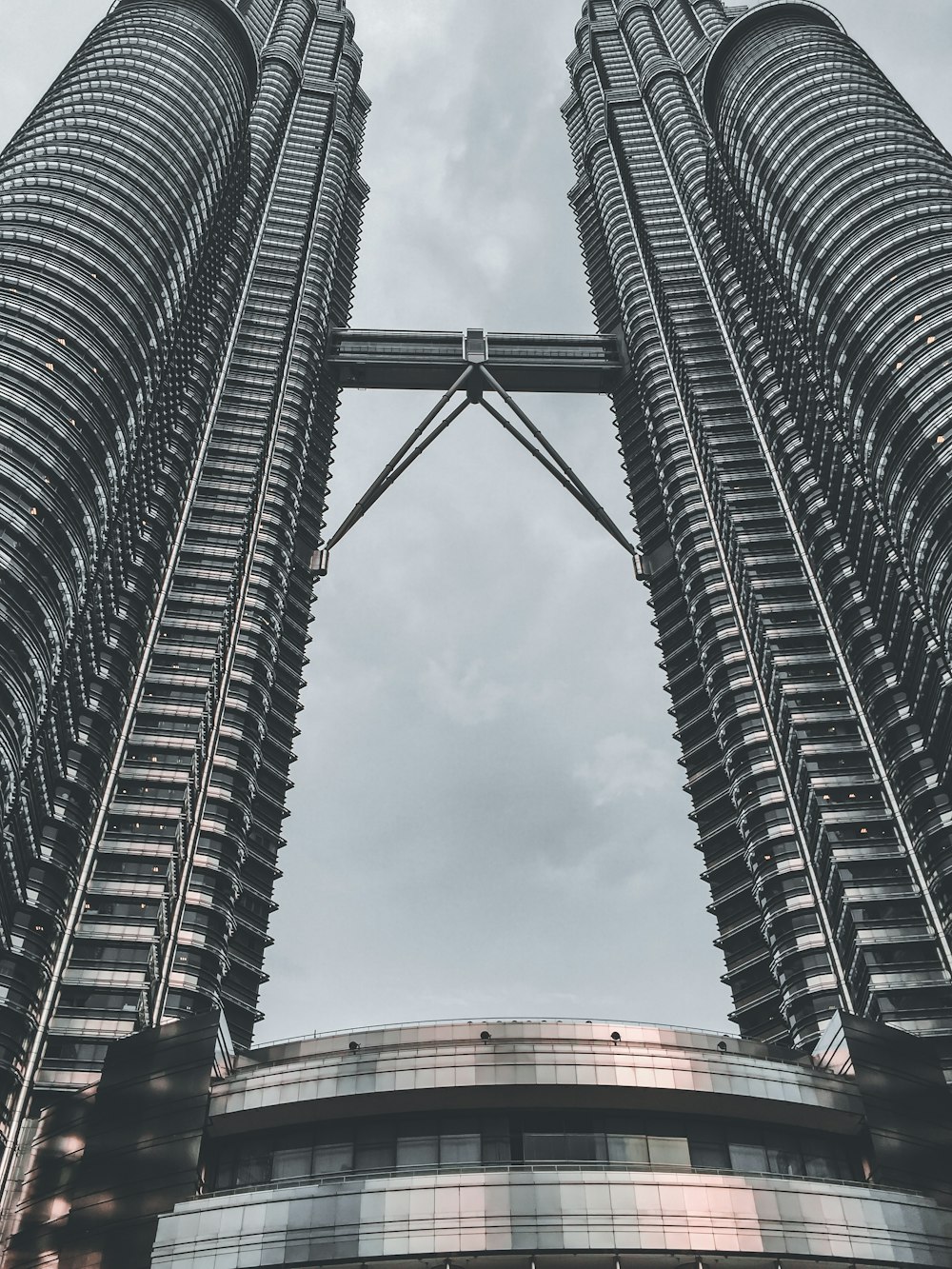 two very tall buildings towering into the sky