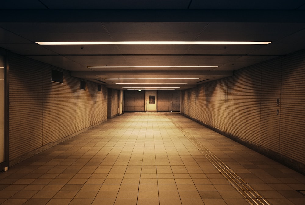 a dimly lit hallway with no people in it