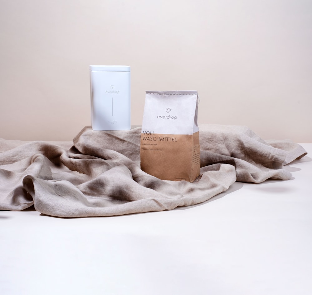 a bag of coffee sitting on top of a blanket