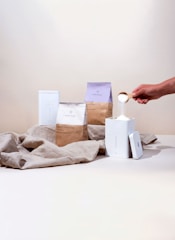 a person is putting something in a container