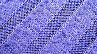 Close-up of soft, breathable fabric with a subtle Zolke logo.