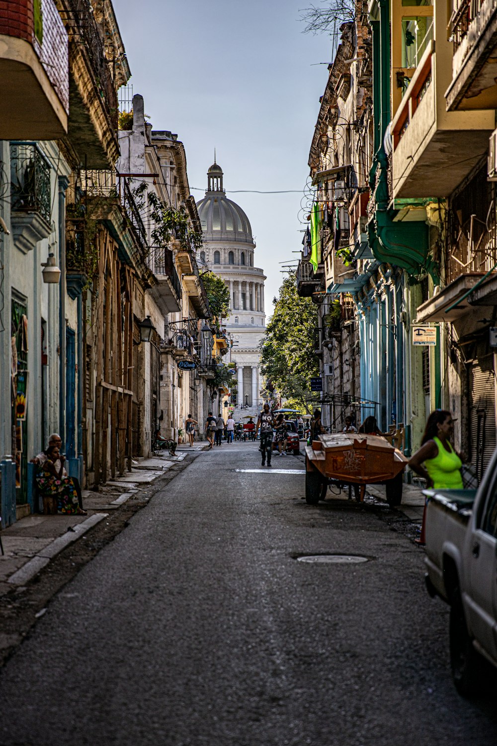 a city street with cars parked on both sides of it