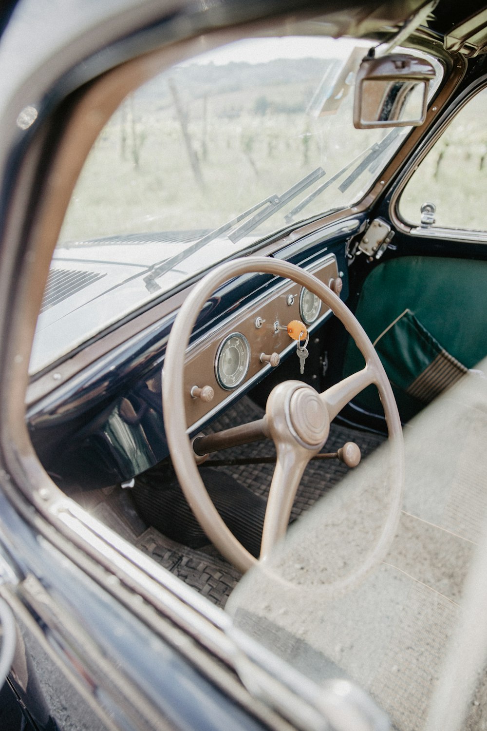 the interior of a car with a steering wheel and dashboard