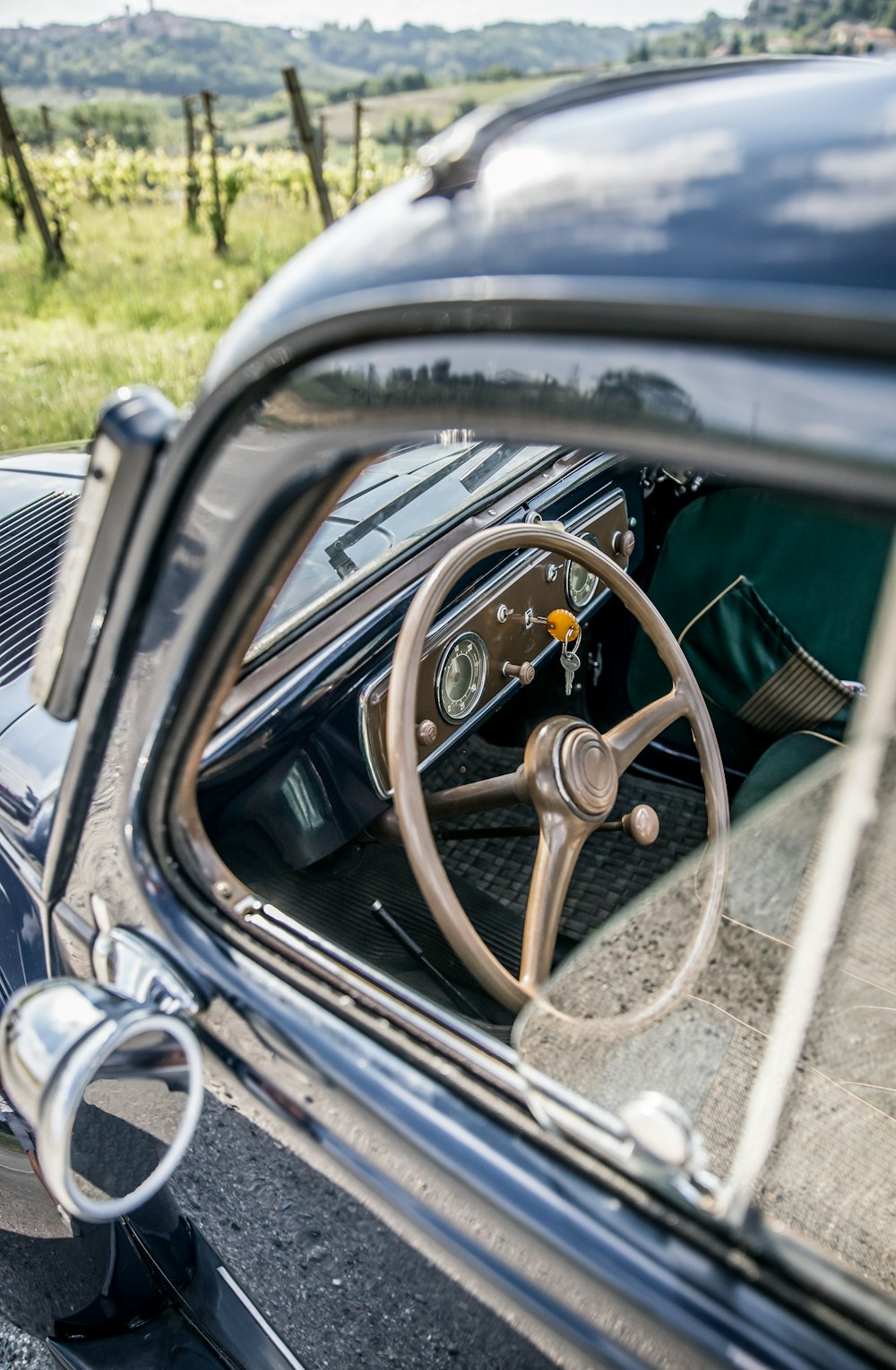 the interior of an old car with a steering wheel