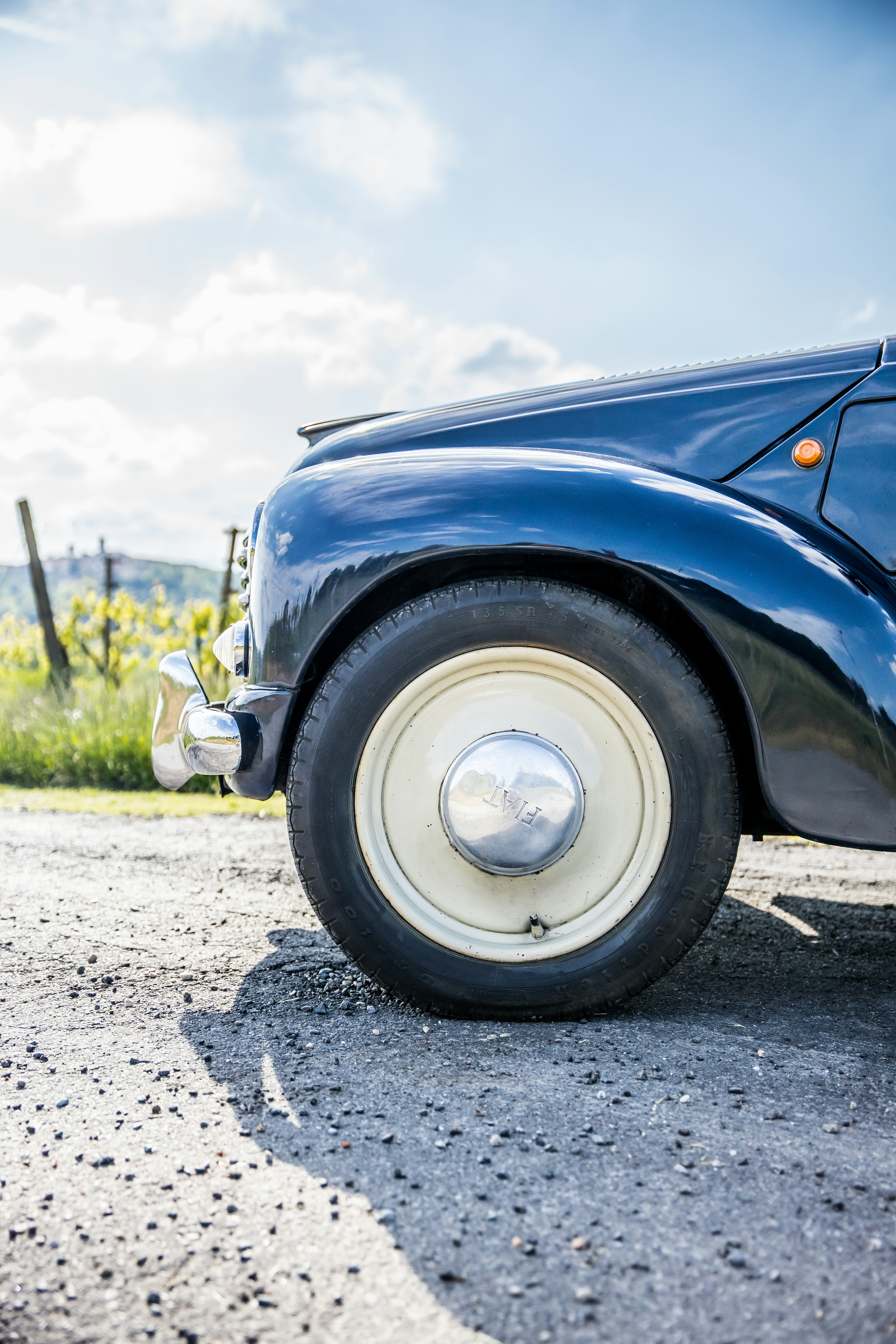 a close up of a blue car on a road