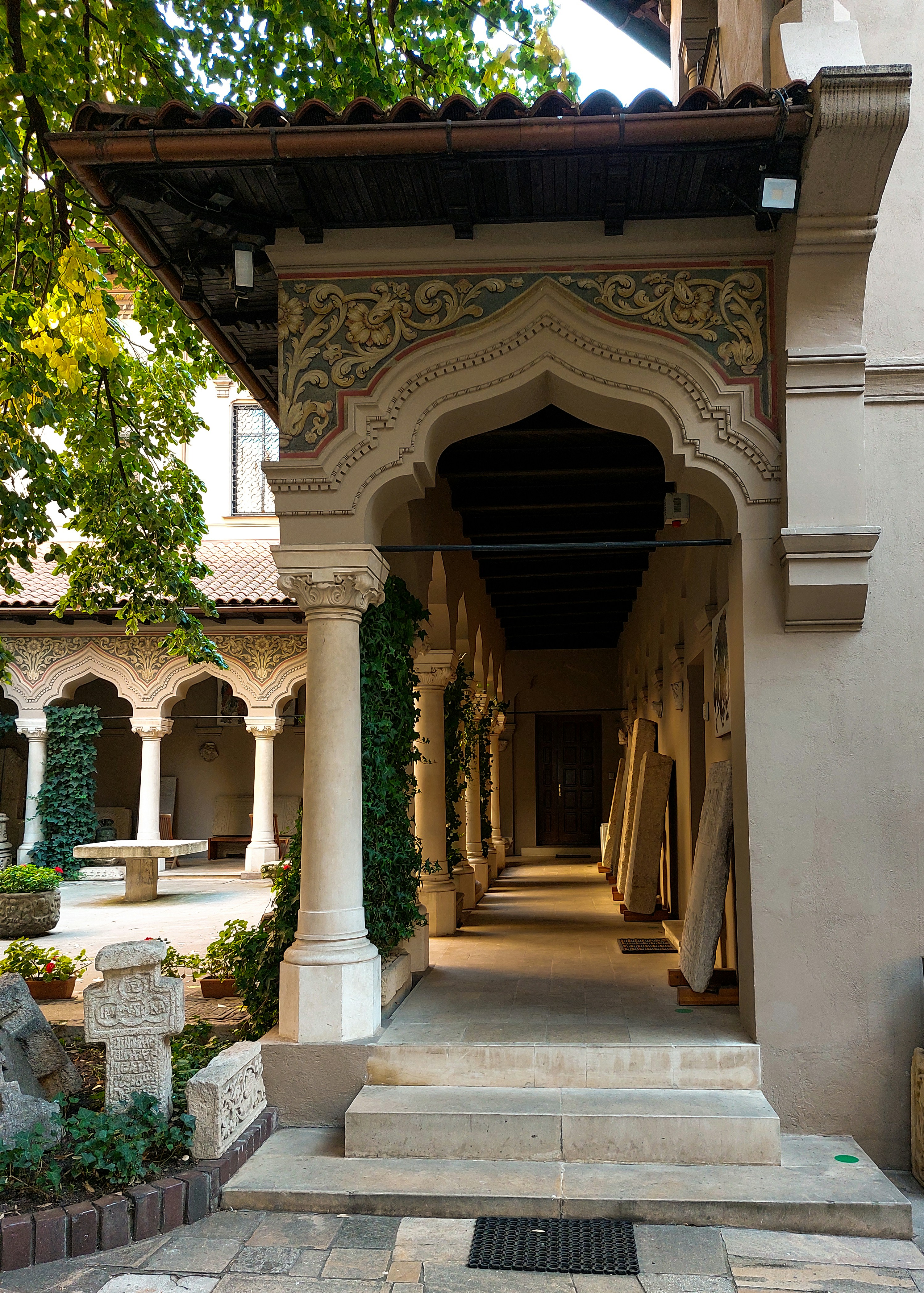 a building with a large archway and steps leading up to it