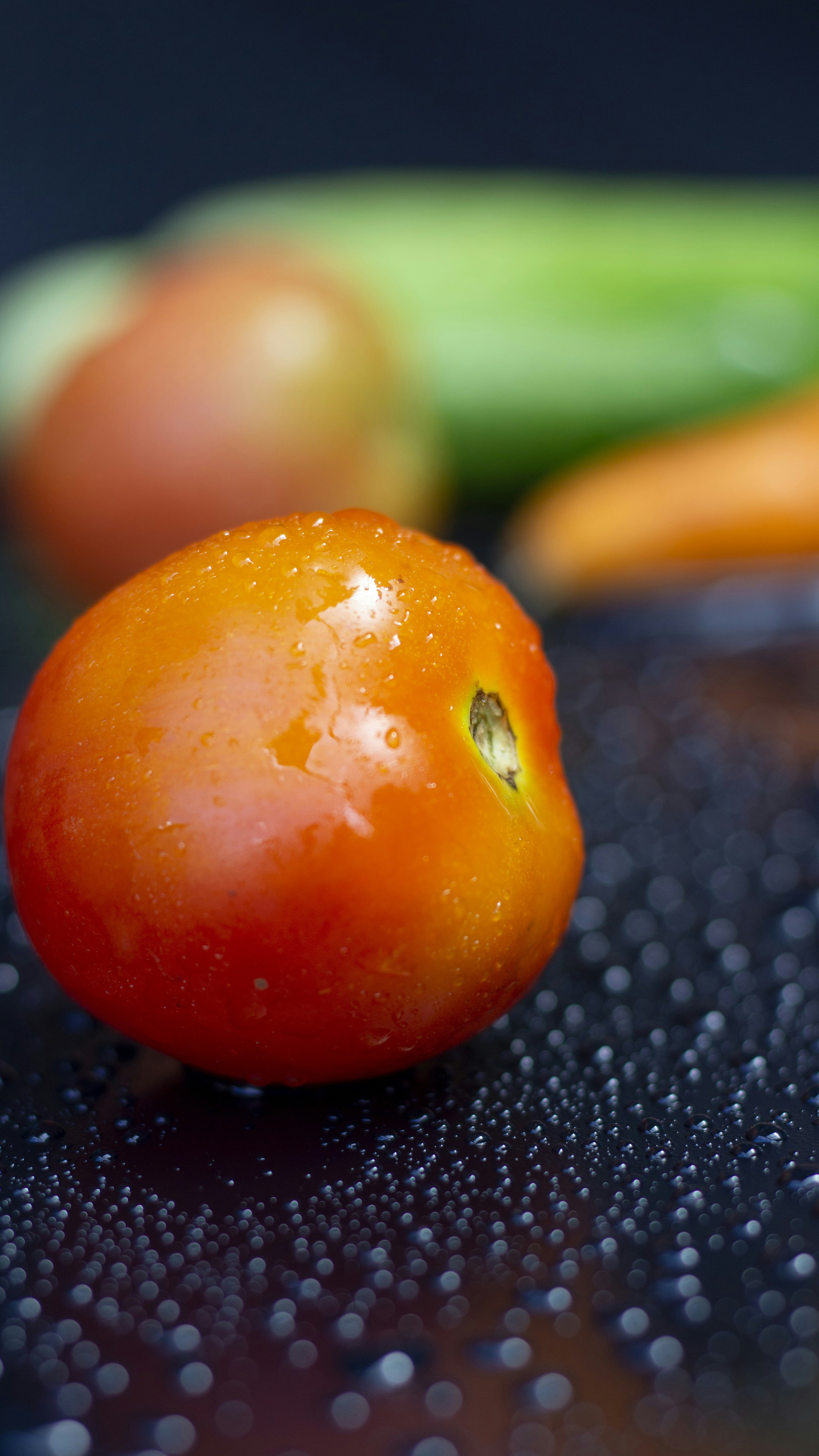 a close up of a tomato on a table