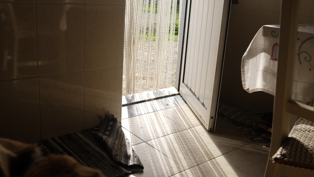 a bathroom with a shower and a towel rack