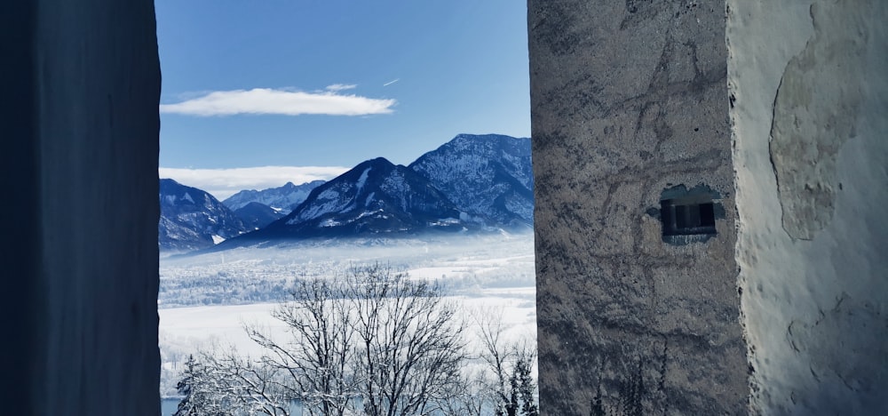 a view of mountains from a window in a building