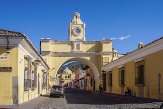 a yellow building with a clock tower on top of it