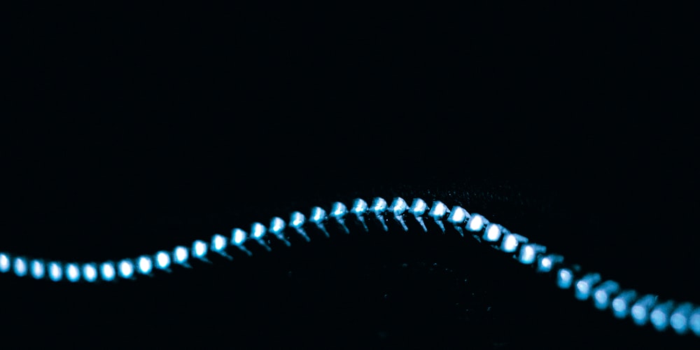 a black background with a blue spiral of light