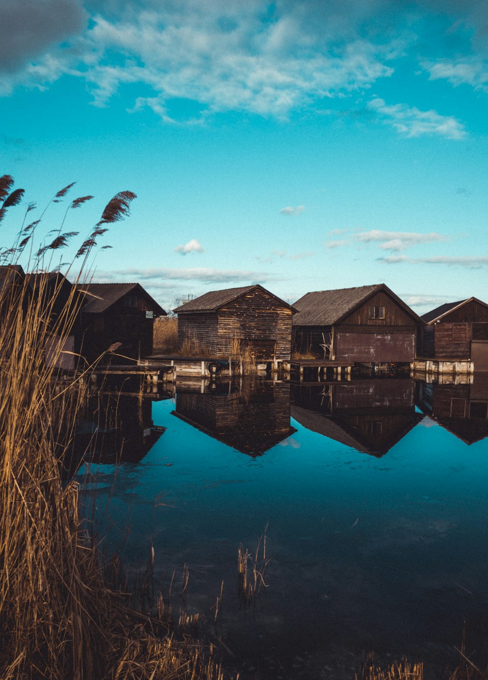 a body of water surrounded by wooden houses