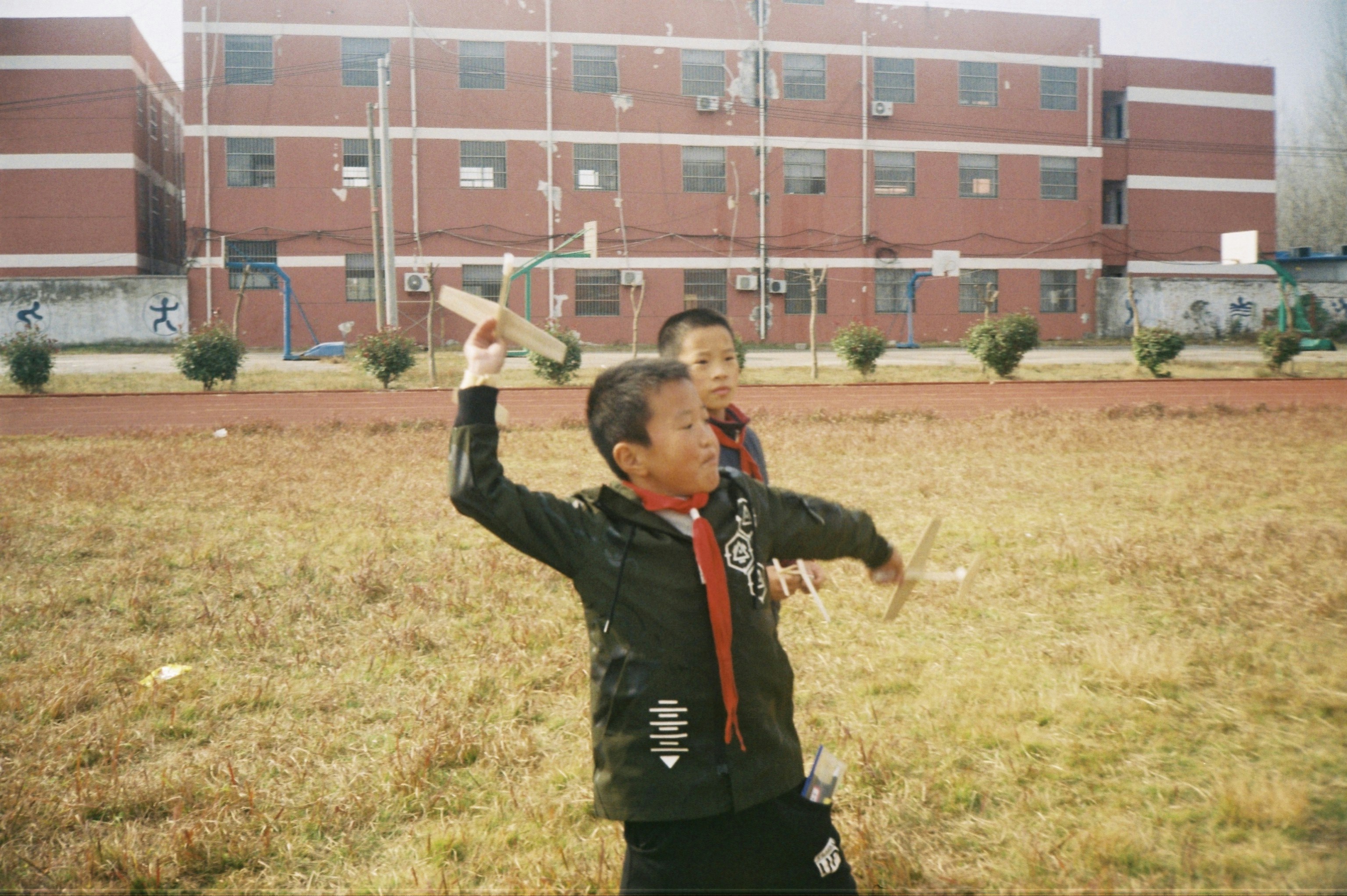 Young boy with kite celebrating