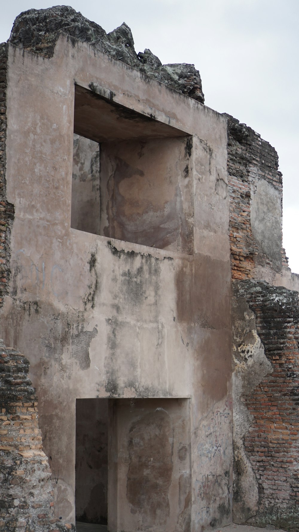 a very old building with a door in it