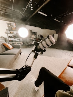 a room with a couch and a microphone in it