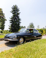 a black sports car parked on the side of a road